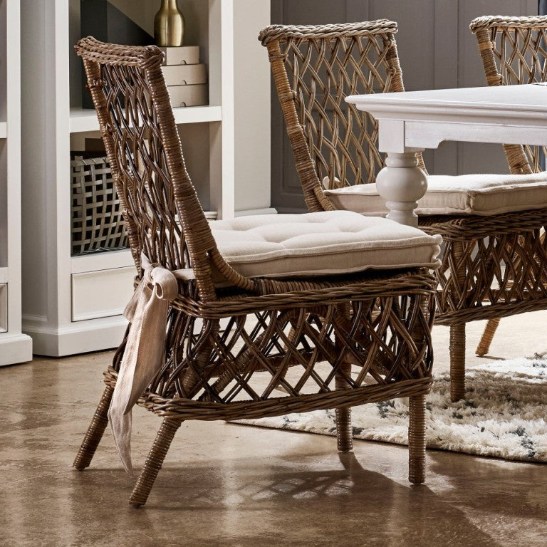 Sedia in rattan con cuscino