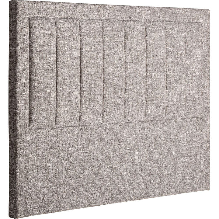 Testata letto Ruenes elegante con rivestimento grigio marmo screziato.